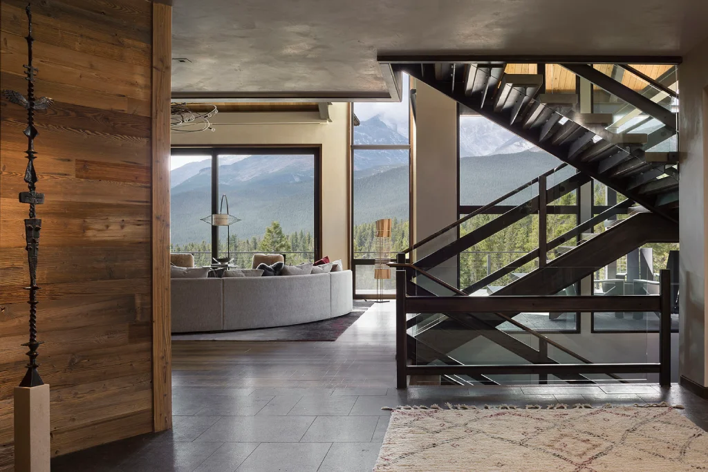 Interior of a home with a modern staircase, large windows, in Rural Estes Park, Colorado