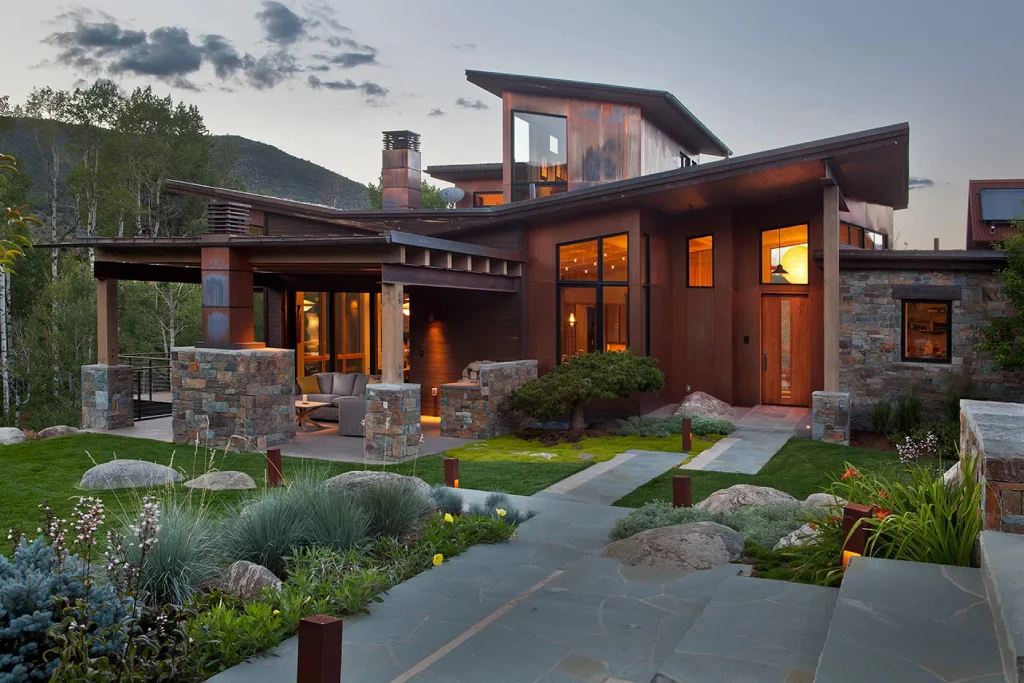 Contemporary home with stone and wood design, large windows, in Vail Valley, Colorado