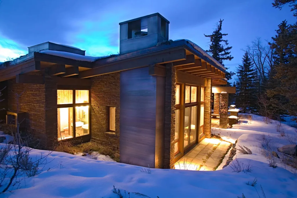 Modern family cabin with large windows and stone elements, nestled in Steamboat Springs, Colorado.