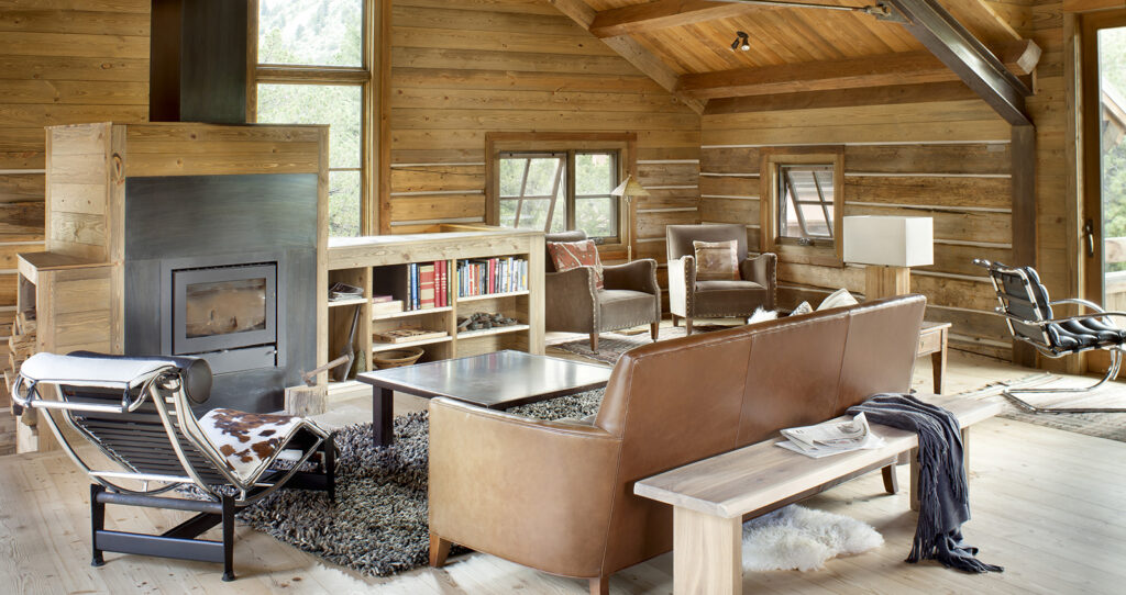 Secluded retreat with restored historic log structures and modern interiors by Chalk Creek